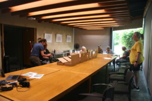 Dawn is teaching the participants how to use the audio recorder.