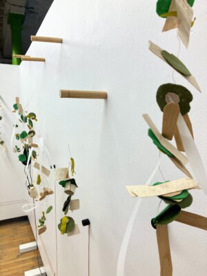 A close up view of the sculptures from the right side looking down the wall.