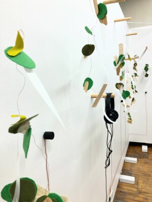 A close up view of the mobile sculptures from the left side of the wall.